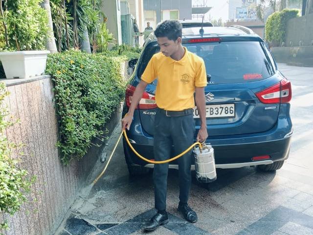 Treating drains and parking areas to control mosquito breeding