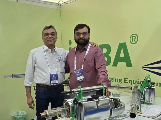 Reviewing professional pest control equipment at an industry exhibition