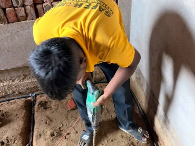 Safe Home Pestochem technician installing termite reticulation pipework at a building under construction