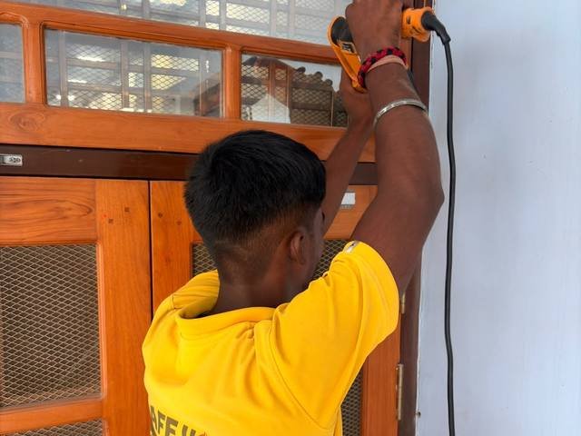 Treating a wooden door frame against wood borer